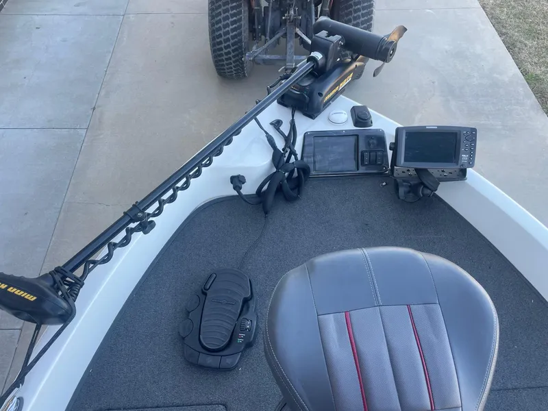 Slide: The Image of 2014 Ranger 211 VS boat cockpit with steering, electronics, and seating. - 8