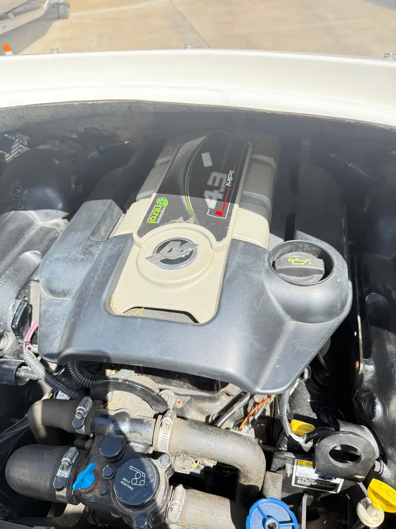 Slide: The Image of Engine of a 2012 Hurricane 201 Sundeck Sport boat, featuring a 4.3L MPI motor. - 9