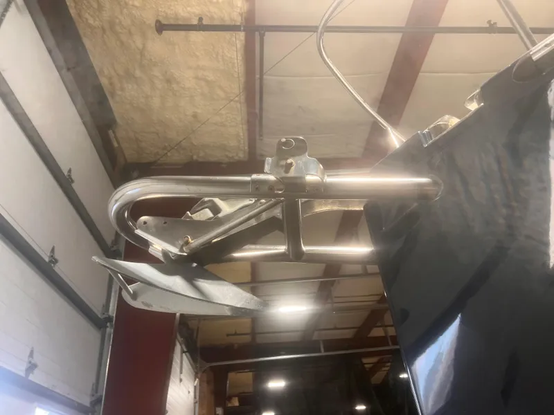 Slide: The Image of Close-up of a 2006 True North 38' Heritage boat anchor in a garage setting. - 21