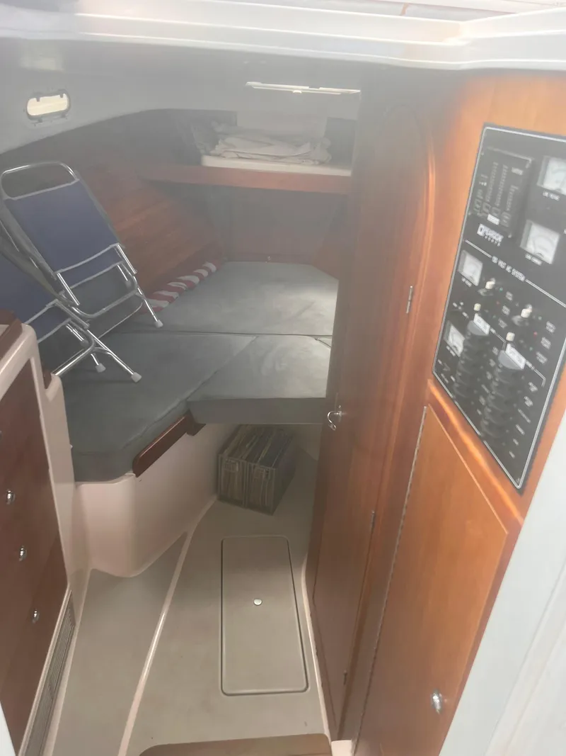 Slide: The Image of Interior cabin of 2006 True North 38' Heritage boat with control panel and seating. - 38