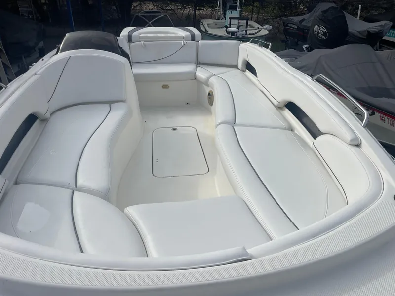 Slide: The Image of 2011 Bayliner 197 boat interior with white seating and spacious layout. - 6