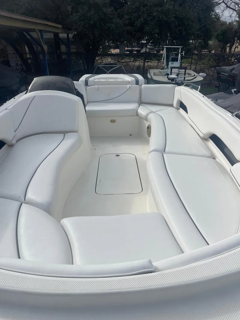 Slide: The Image of 2011 Bayliner 197 boat with spacious white seating and sleek design. - 9