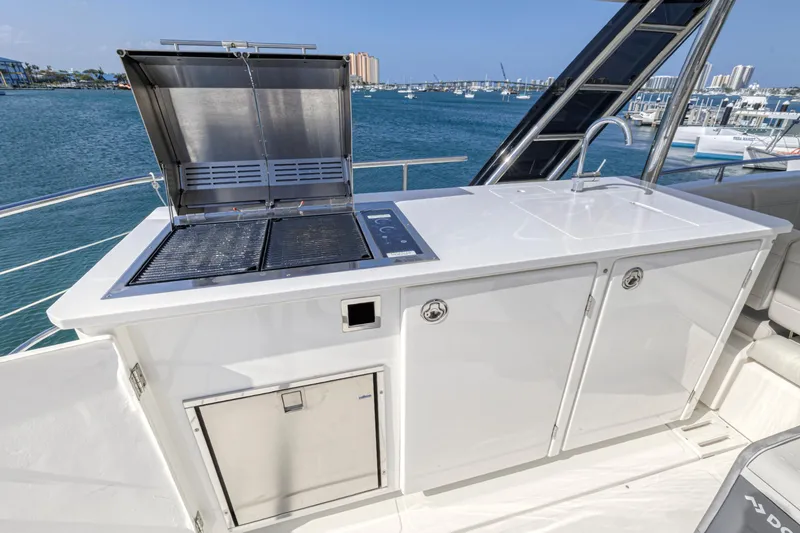 Slide: The Image of 2023 Aquila 54 Yacht cockpit with modern navigation equipment and luxurious seating. - 10
