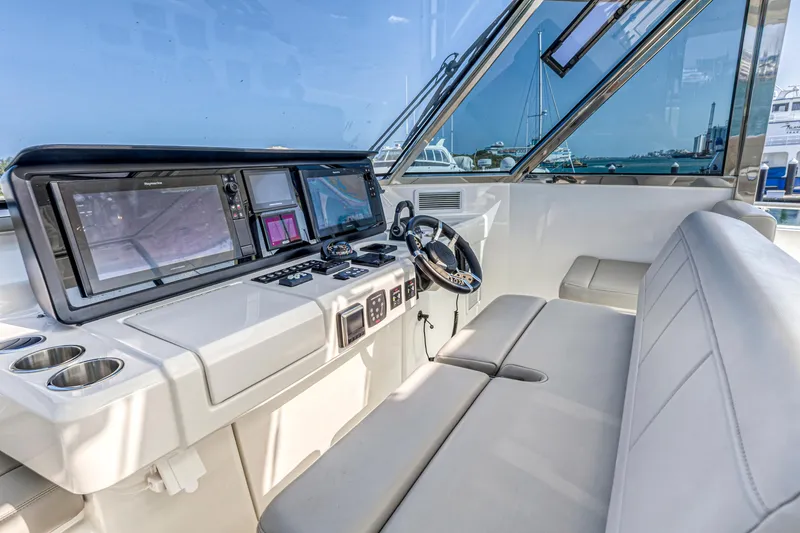 Slide: The Image of Luxurious interior of 2023 Aquila 54 Yacht with modern seating and panoramic windows. - 16
