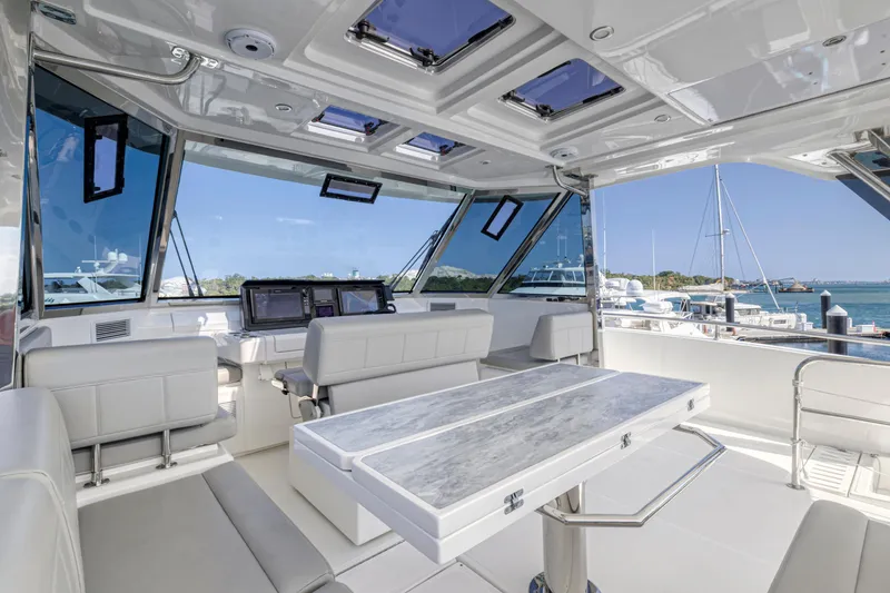 Slide: The Image of Outdoor kitchen on 2023 Aquila 54 Yacht with grill and sink, overlooking marina. - 18