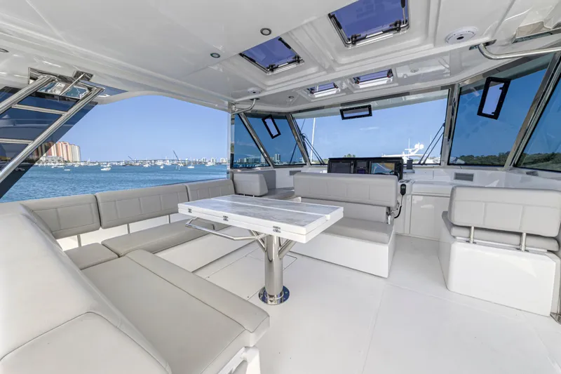 Slide: The Image of Luxurious seating area on 2023 Aquila 54 Yacht with ocean view. - 21
