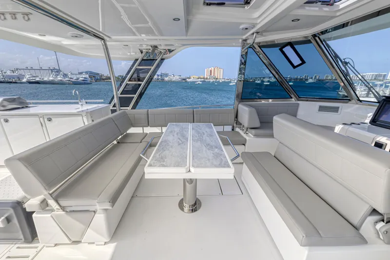 Slide: The Image of Luxurious 2023 Aquila 54 Yacht interior with modern seating and panoramic views. - 24
