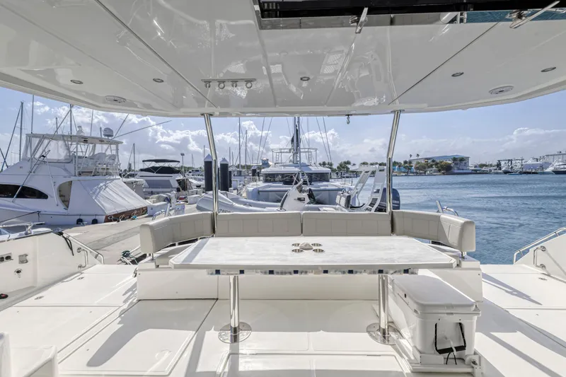 Slide: The Image of Luxurious interior of 2023 Aquila 54 Yacht with modern seating and panoramic windows. - 25