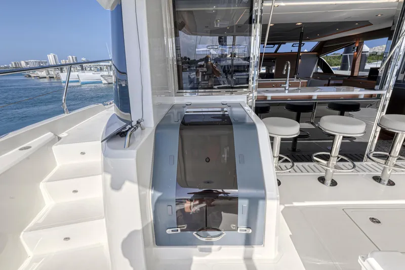 Slide: The Image of Interior view of 2023 Aquila 54 Yacht with modern seating and navigation equipment. - 28