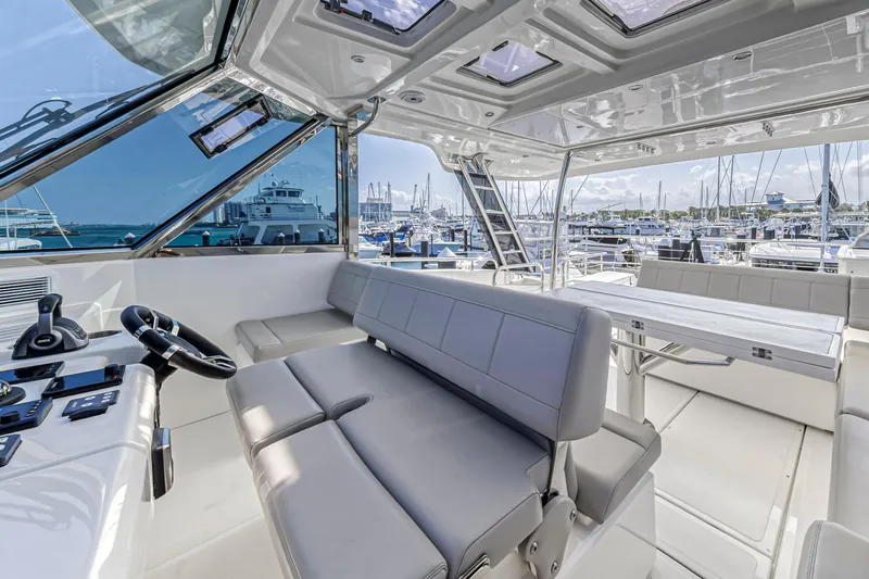 Slide: The Image of Luxurious interior of 2023 Aquila 54 Yacht with modern seating and panoramic windows. - 7