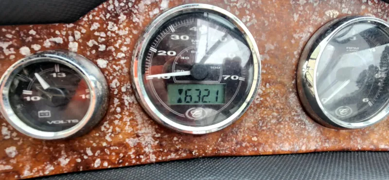 Slide: The Image of Dashboard of a 2011 Cobalt 242 boat showing gauges and odometer reading 632.1 hours. - 13