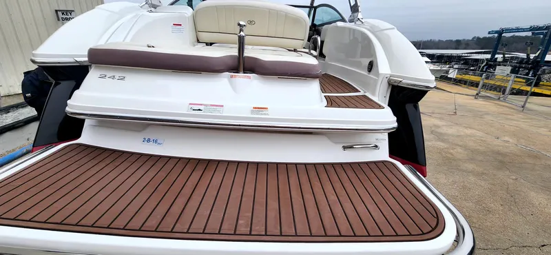 Slide: The Image of 2011 Cobalt 242 boat with teak swim platform, docked at marina. - 7