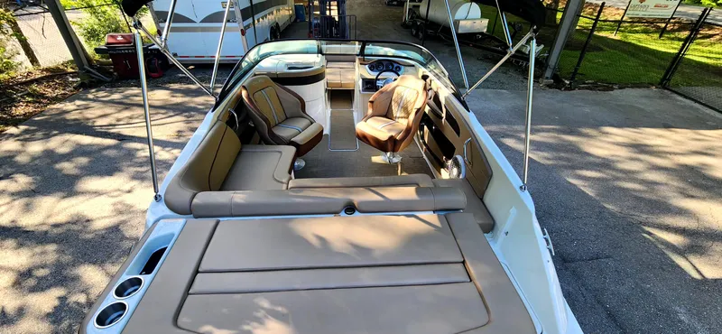 Slide: The Image of 2017 Sea Ray SDX 220 boat interior with tan seating and open deck layout. - 11