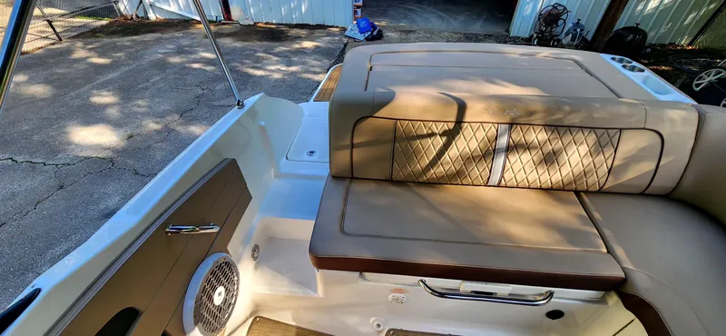 Slide: The Image of 2017 Sea Ray SDX 220 boat interior with tan seating and speaker. - 14