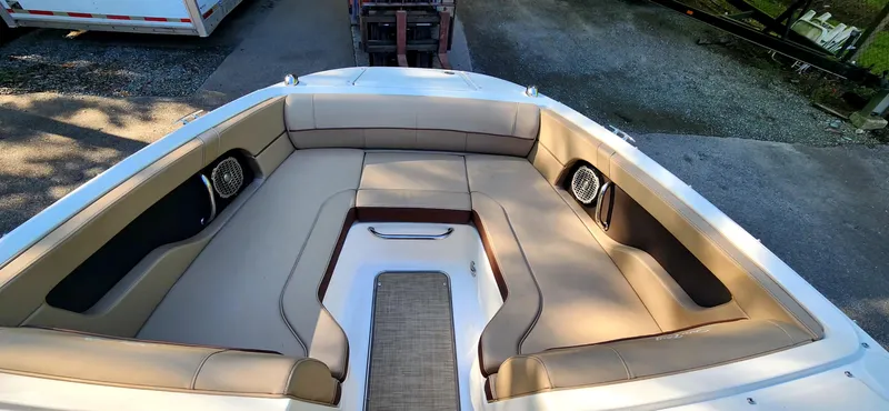 Slide: The Image of 2017 Sea Ray SDX 220 boat interior with spacious seating and speakers. - 16