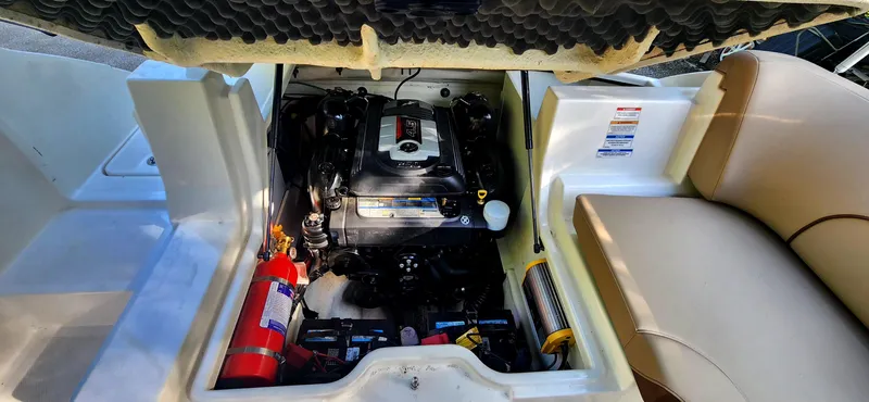 Slide: The Image of Engine compartment of a 2017 Sea Ray SDX 220 boat, featuring a well-organized layout. - 20