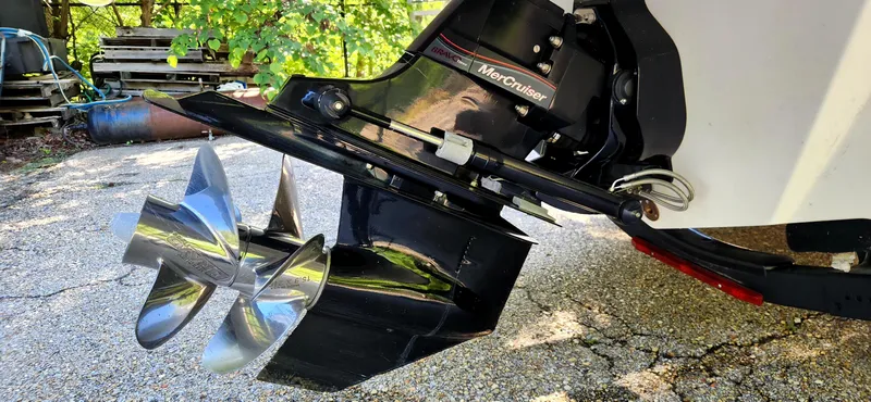 Slide: The Image of 2017 Sea Ray SDX 220 boat propeller and outdrive, featuring a MerCruiser engine. - 24