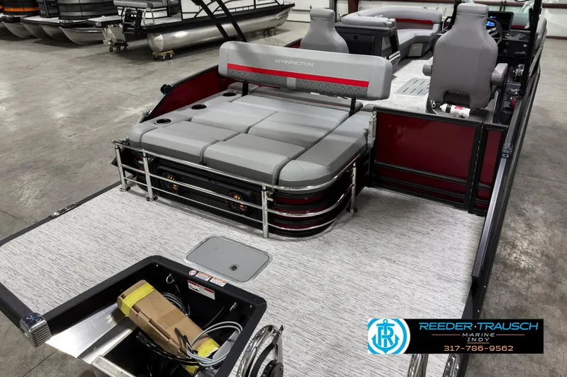 Slide: The Image of 2025 Bennington 24 MSB pontoon boat interior with gray seating and storage compartments. - 11