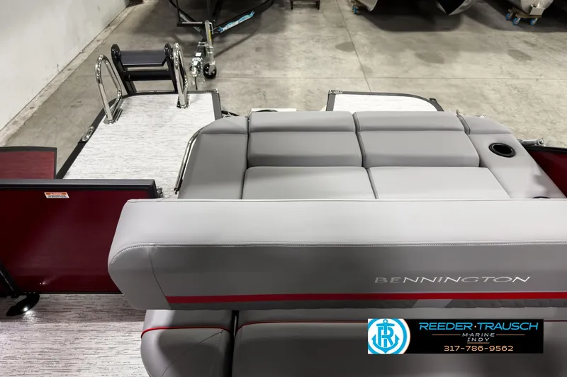 Slide: The Image of 2025 Bennington 24 MSB boat interior with gray seating and red accents. - 15