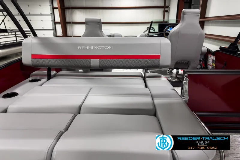 Slide: The Image of 2025 Bennington 24 MSB boat interior with gray seating and red accents. - 16