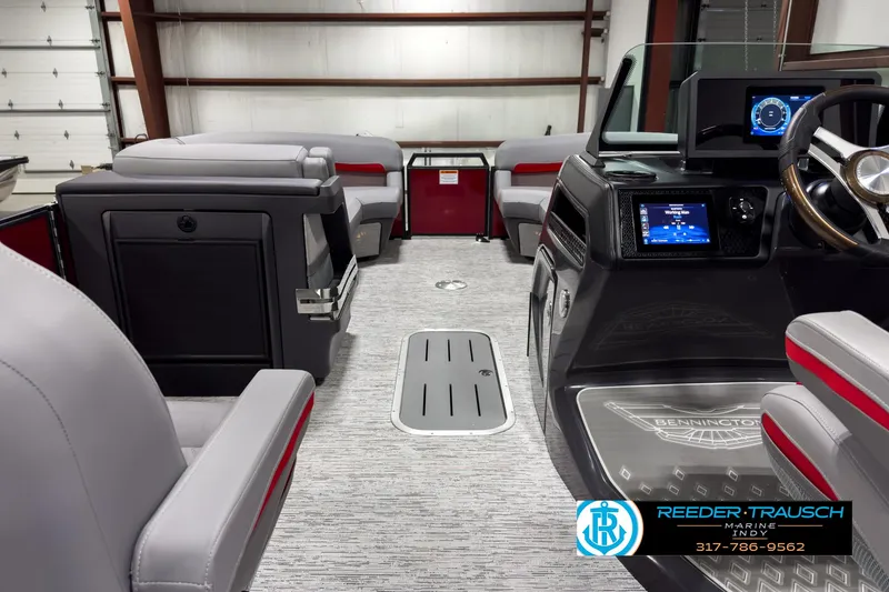 Slide: The Image of 2025 Bennington 24 MSB boat interior with modern dashboard and seating. - 17