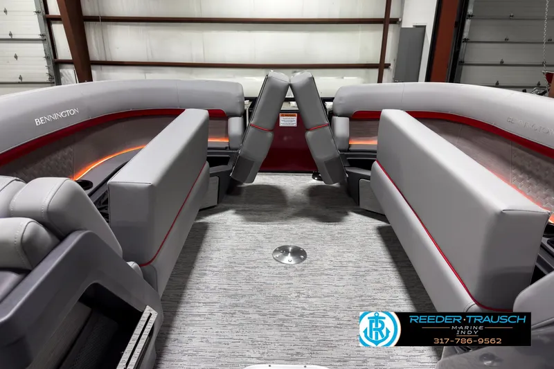 Slide: The Image of 2025 Bennington 24 MSB boat interior with gray seating and red accents. - 19