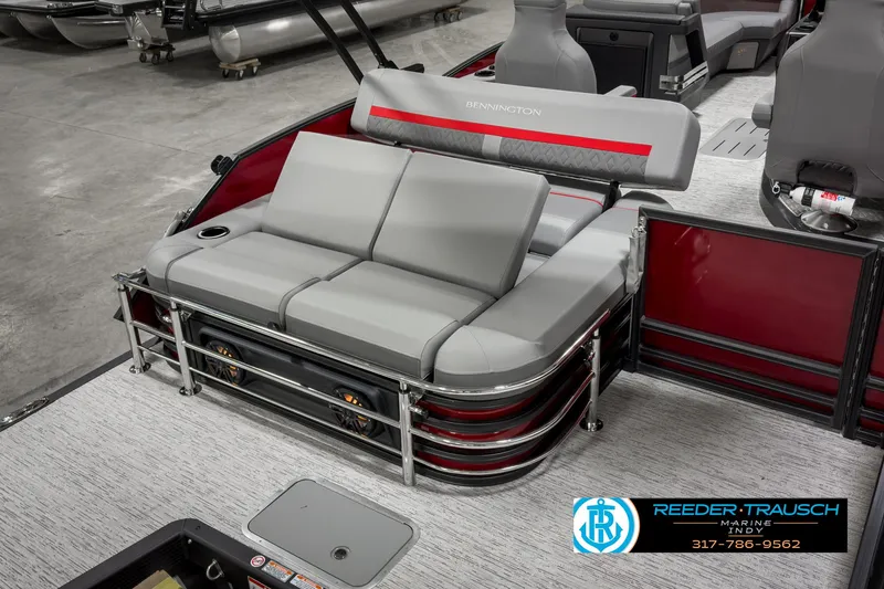 Slide: The Image of 2025 Bennington 24 MSB pontoon boat interior with gray seating and red accents. - 23