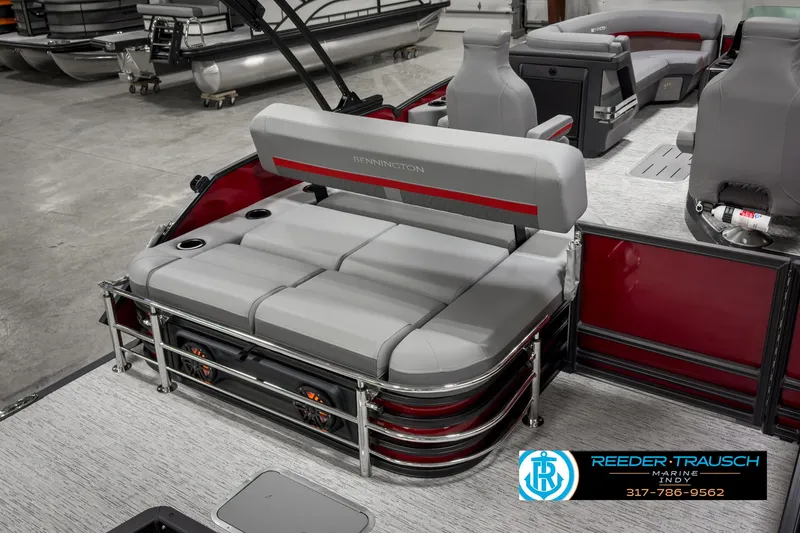 Slide: The Image of 2025 Bennington 24 MSB pontoon boat interior with gray seating and red accents. - 25