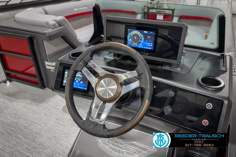 Slide: The Image of 2025 Bennington 24 MSB boat dashboard with modern steering wheel and digital displays. - 30