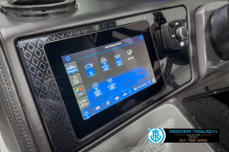 Slide: The Image of 2025 Bennington 24 MSB dashboard with touchscreen controls and Reeder-Trausch branding. - 33
