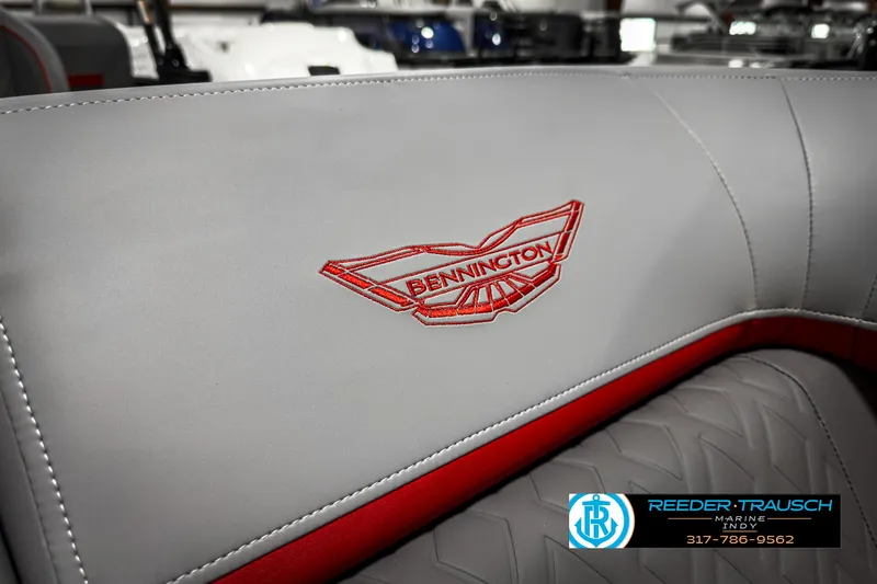 Slide: The Image of 2025 Bennington 24 MSB boat seat with red logo embroidery and Reeder-Trausch Marine branding. - 37
