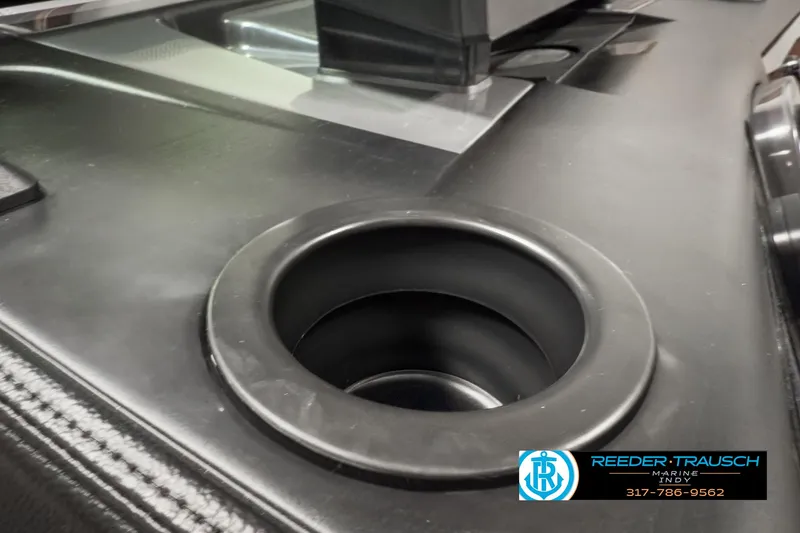 Slide: The Image of Cup holder on 2025 Bennington 24 MSB boat console, Reeder-Trausch logo visible. - 40