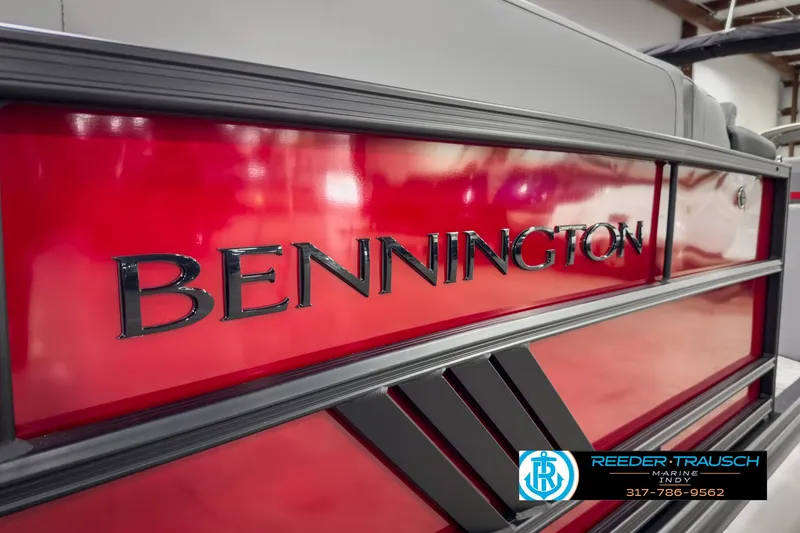 Slide: The Image of 2025 Bennington 24 MSB boat with red exterior, showcased at Reeder-Trausch Marine. - 43