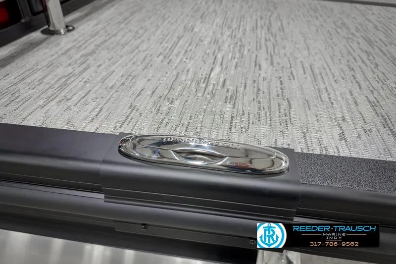 Slide: The Image of 2025 Bennington 24 MSB boat detail with sleek design and Reeder-Trausch Marine logo. - 47