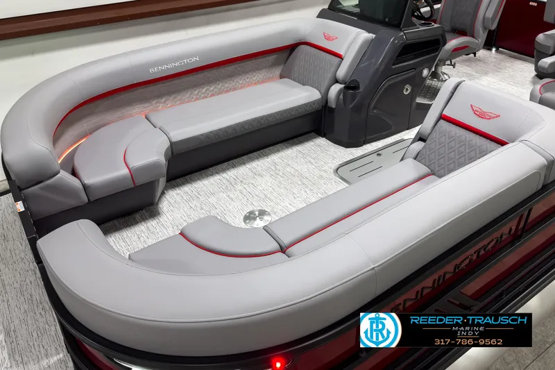 Slide: The Image of 2025 Bennington 24 MSB boat interior with luxurious gray seating and red accents. - 9