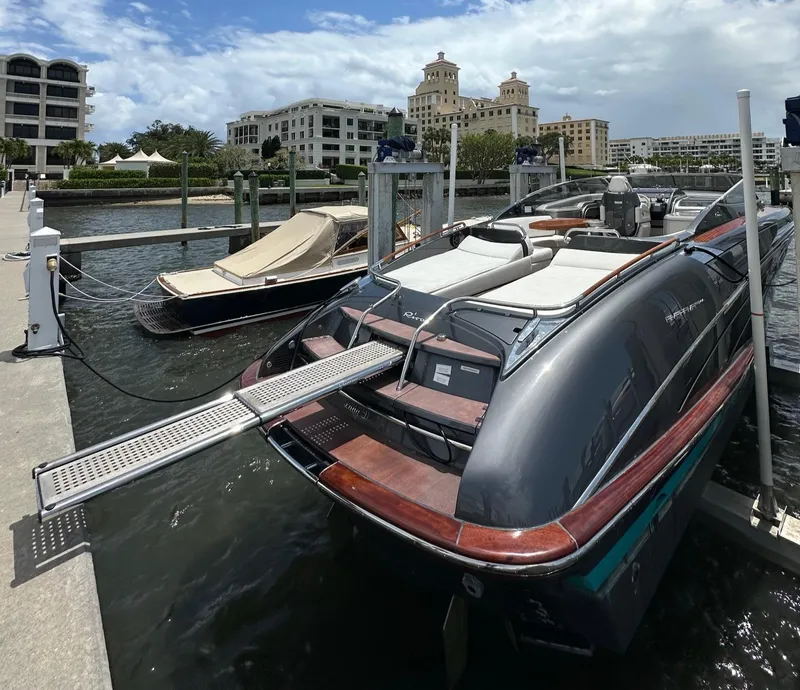 Slide: The Image of Luxury 2015 Riva Rivarama Super yacht docked at marina with elegant design and scenic backdrop. - 12