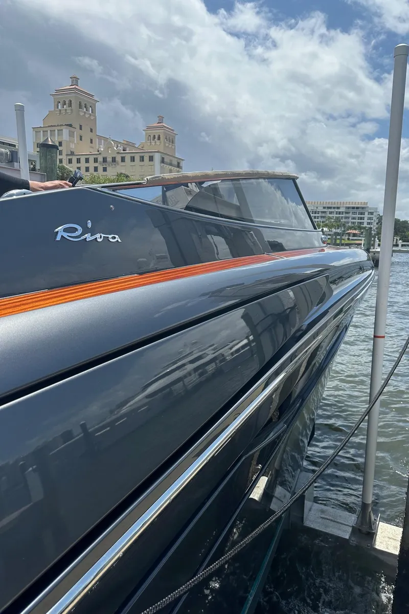 Slide: The Image of 2015 Riva Rivarama Super yacht docked, sleek design, luxury waterfront setting. - 14