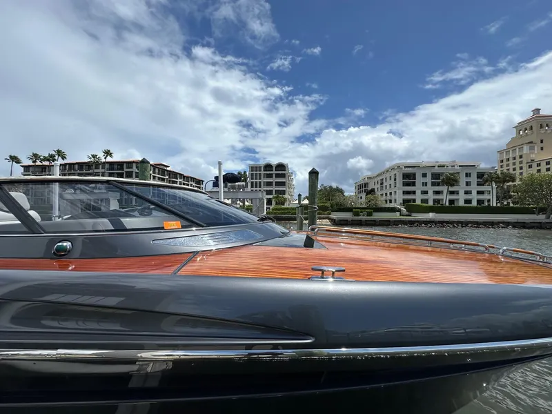 Slide: The Image of 2015 Riva Rivarama Super yacht docked, showcasing sleek design and luxury finish. - 15
