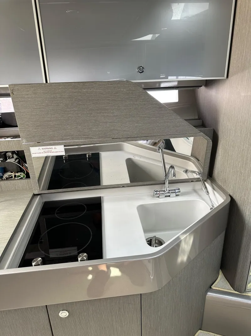 Slide: The Image of 2015 Riva Rivarama Super yacht kitchen with modern sink and stovetop. - 24