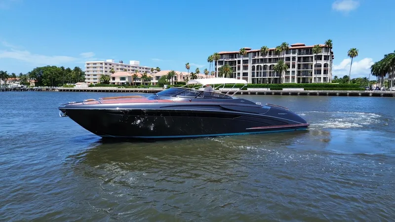 Slide: The Image of 2015 Riva Rivarama Super yacht cruising on a sunny day near waterfront buildings. - 6