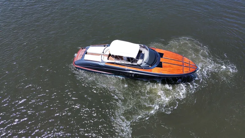 Slide: The Image of 2015 Riva Rivarama Super luxury yacht cruising on open water. - 8
