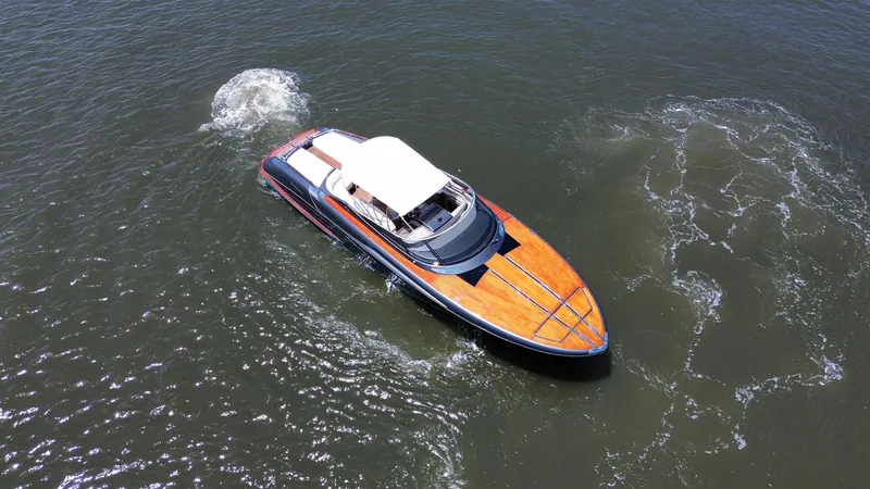 Slide: The Image of 2015 Riva Rivarama Super yacht cruising on open water, aerial view. - 9