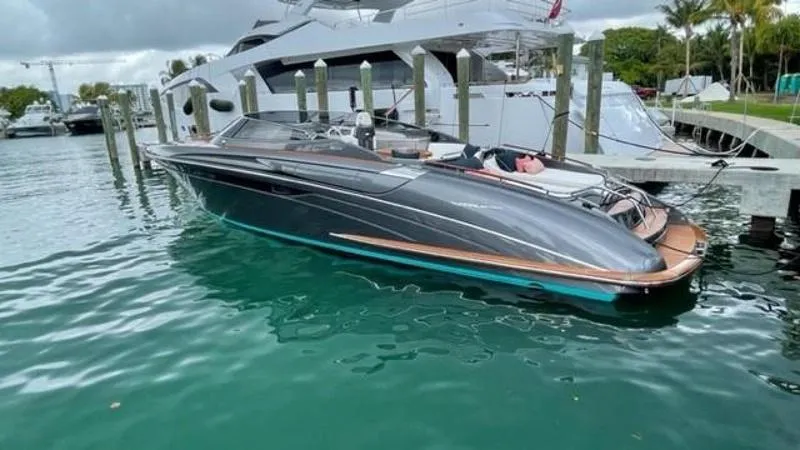 Slide: The Image of 2015 Riva Rivarama Super yacht docked in a marina, sleek design, calm water. - 10