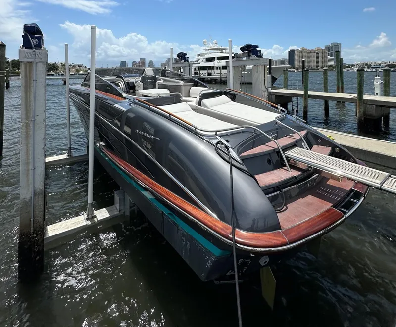 Slide: The Image of 2015 Riva Rivarama Super yacht docked at marina, featuring sleek design and luxurious seating. - 11