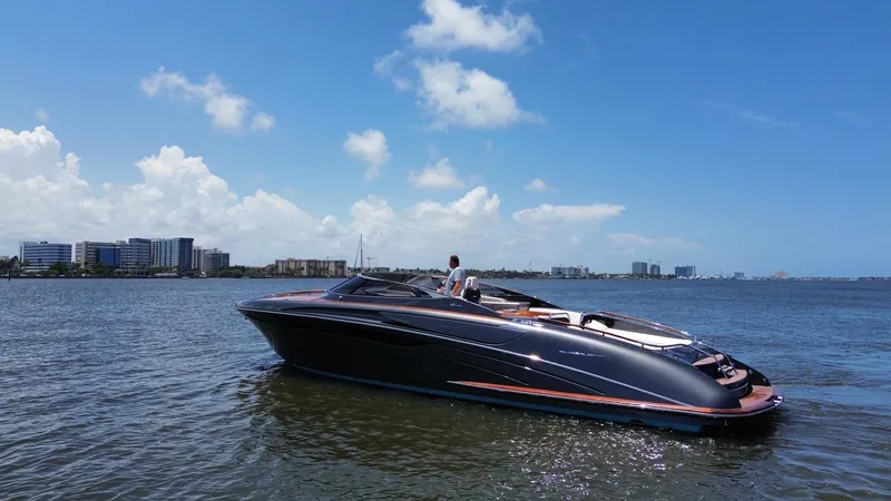 Slide: The Image of 2015 Riva Rivarama Super yacht on calm water under a clear blue sky. - 7