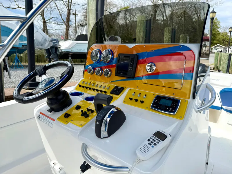 Slide: The Image of Control panel of a 2015 Concept 27' CC boat with vibrant dashboard design. - 15