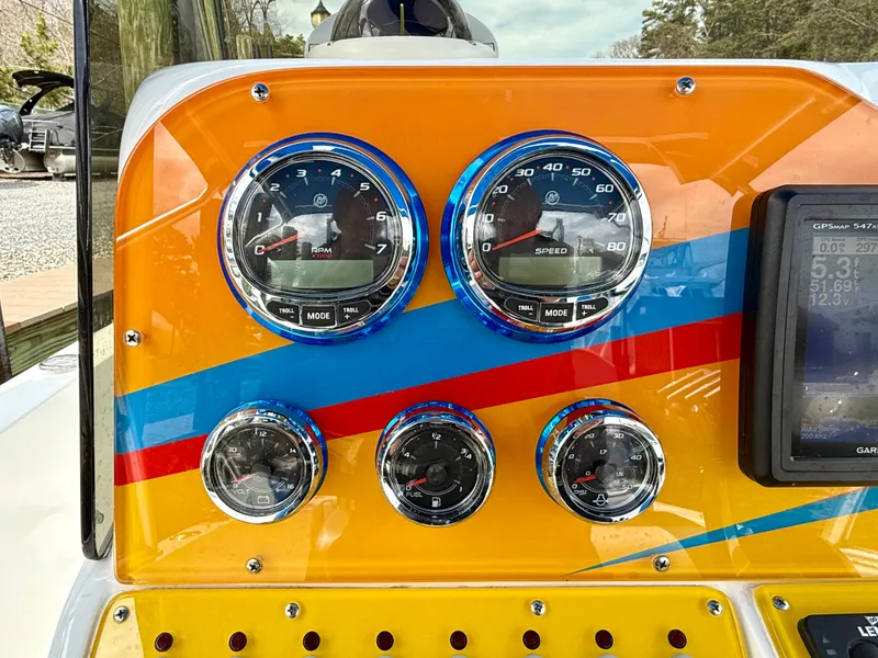 Slide: The Image of Colorful dashboard of a 2015 Concept 27' CC boat with gauges and GPS display. - 17