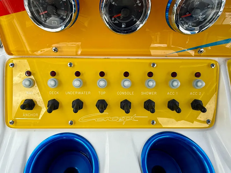 Slide: The Image of Control panel of a 2015 Concept 27' CC boat with switches and gauges. - 18