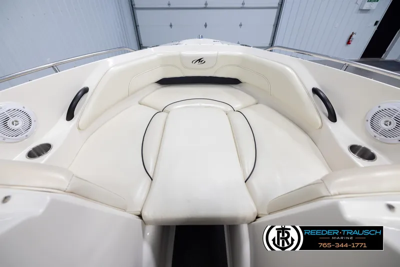 Slide: The Image of 2007 Monterey 234 FS boat interior with white seating and speaker details. - 16