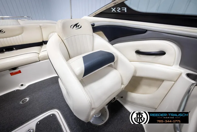 Slide: The Image of 2007 Monterey 234 FS boat interior with white seating and logo. - 26